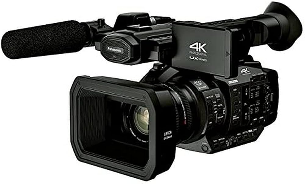 Handheld camcorder connected to a field recorder
