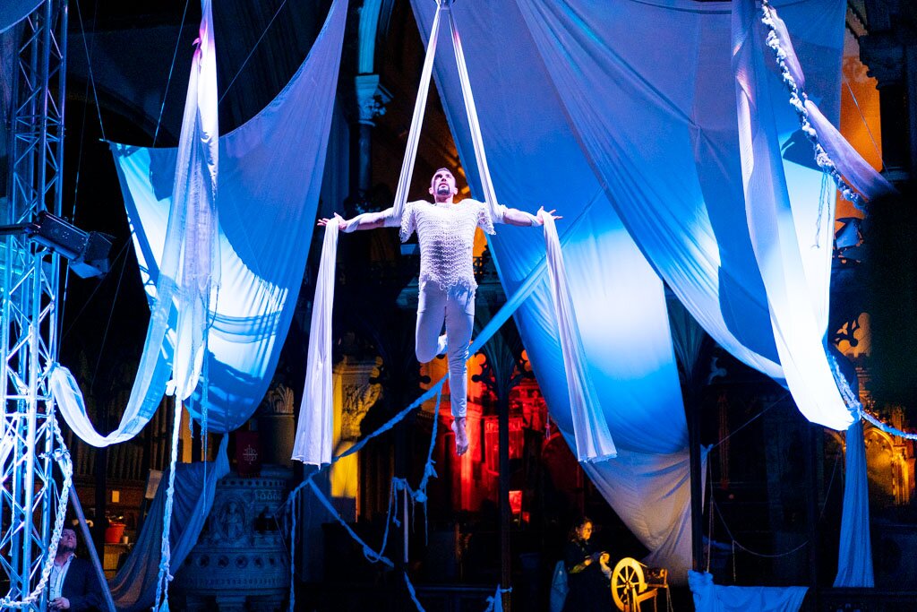 Colourful stage lighting beams over a stage