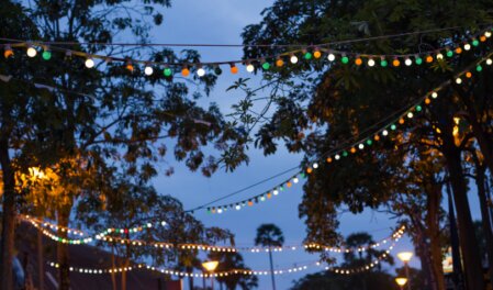 Outdoor event lit with festoon and coloured washes