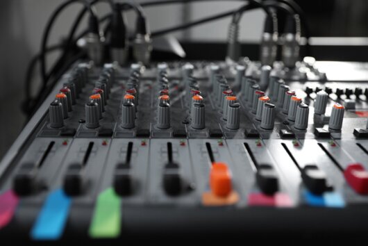 Audio mixer with microphones and cabling neatly arranged