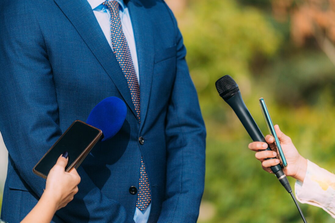 Presenter using a wireless microphone outdoors